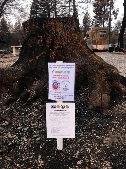 Phase 1 Completion sign and information from Butte County posted on a property.